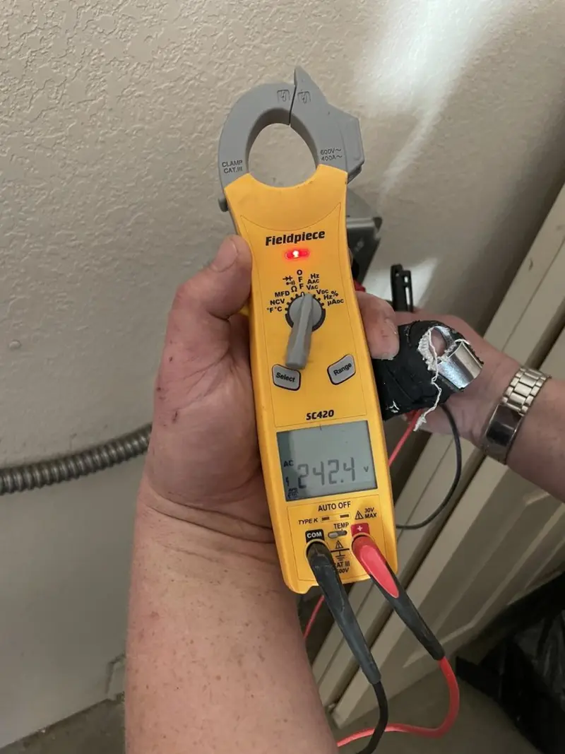 Voltage testing with clamp meter during Electrical Installation Services in Galen